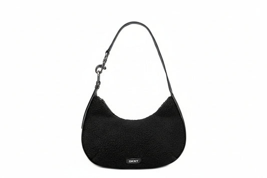 Black textured handbag with DKNY logo on a white background
