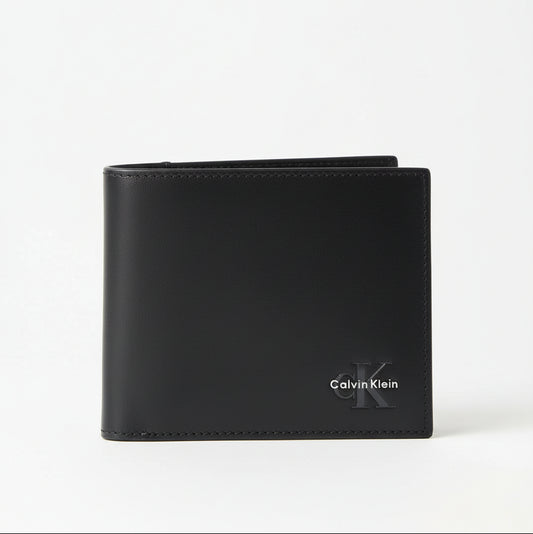 Calvin Klein black leather billfold wallet with a logo on the front