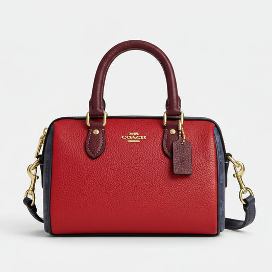 Coach Mini Rowan Crossbody Bag in Colorblock Signature Canvas with a denimbold red color scheme and gold hardware