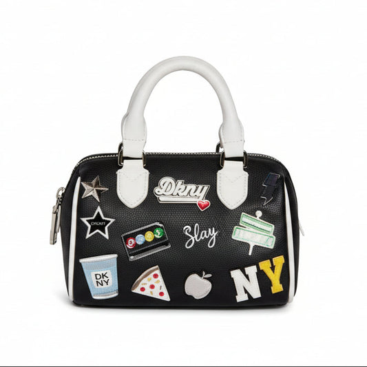 DKNY Nell Mini Satchel Crossbody in black polyurethane with New York themed patches