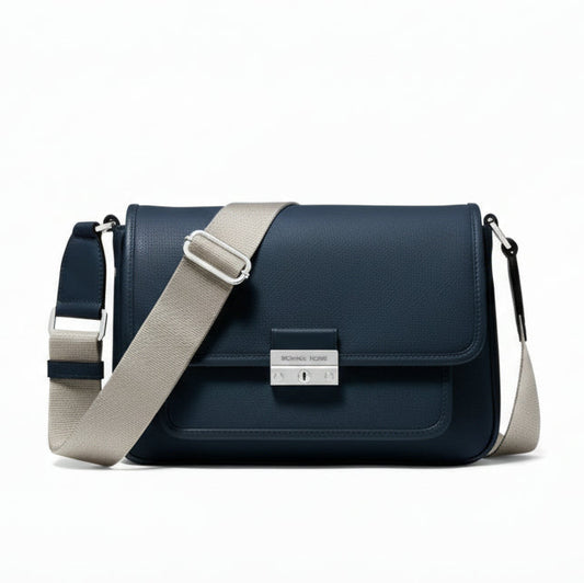 Navy blue shoulder bag with beige strap on a white background