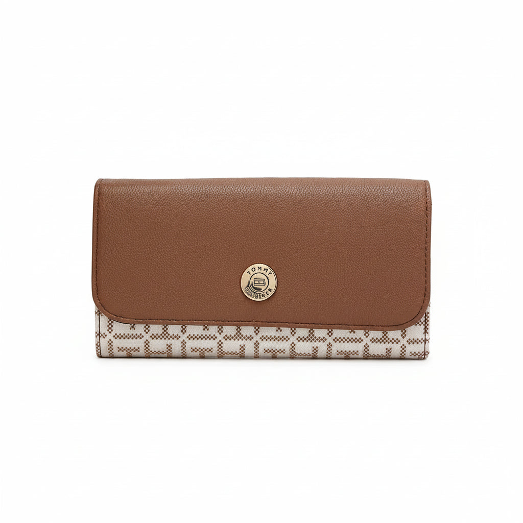 Brown wallet with patterned flap on a white background