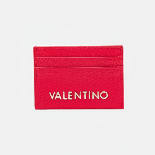 Red cardholder with 'Valentino' branding on a light gray background